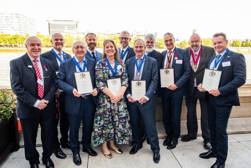 Group of CABE Fellows holding certificates at the House of Lords